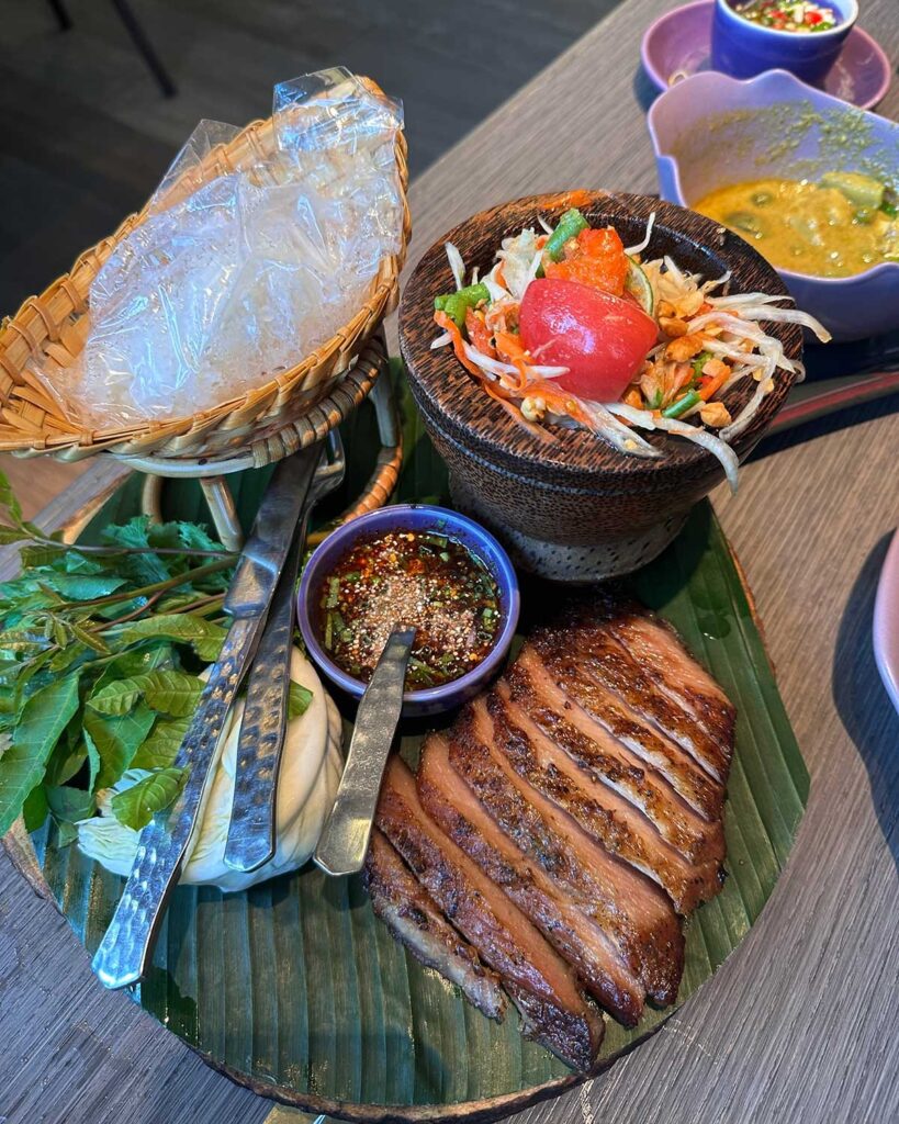 grilled pork neck and sticky rice at Nara Bangkok