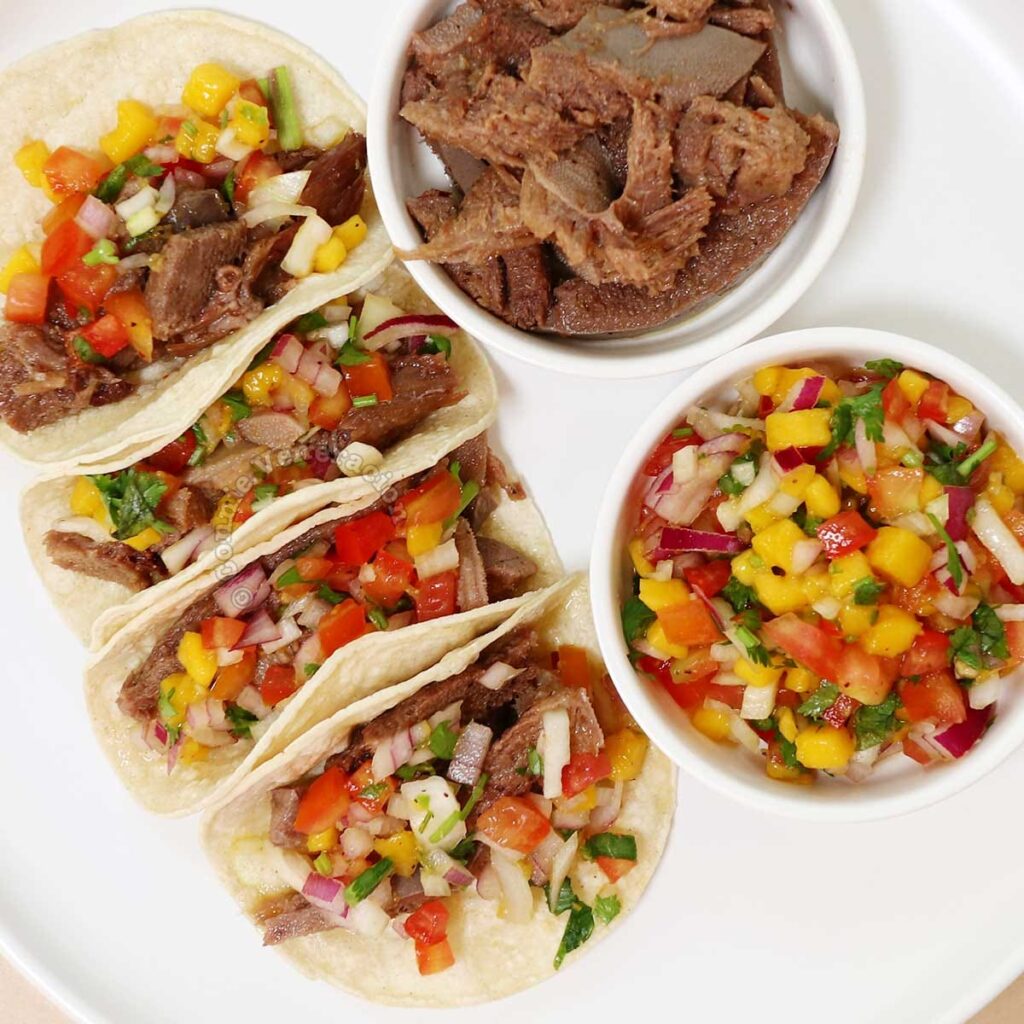 Beef tongue tacos with spicy mango salsa