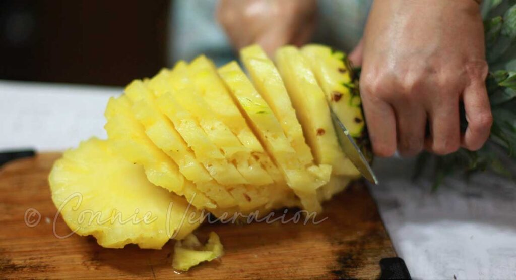 Slicing fresh pineapple