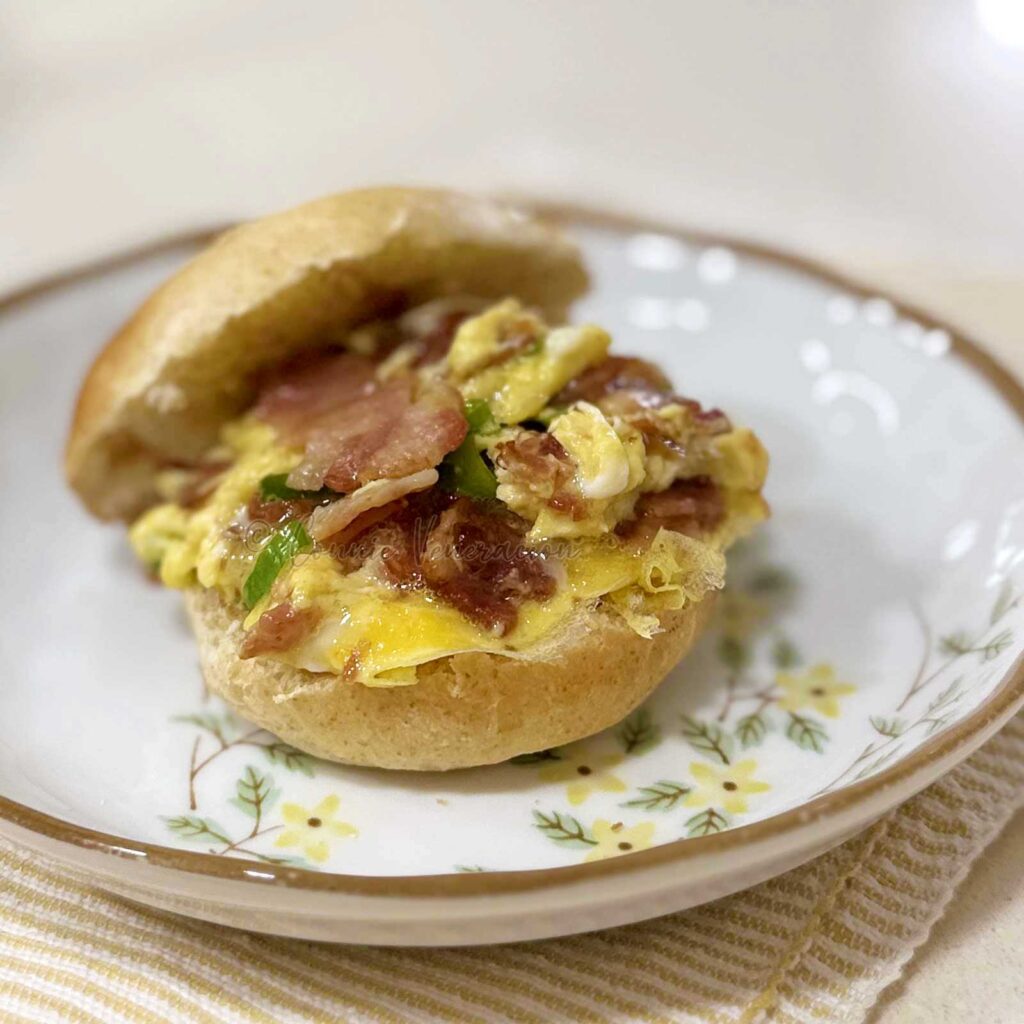 Scrambled eggs and bacon breakfast sandwich